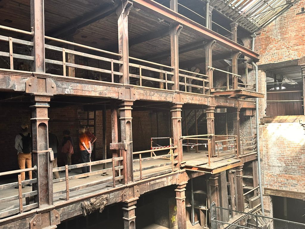 Cast iron and timber multi-storey interior of a former industrial mill building